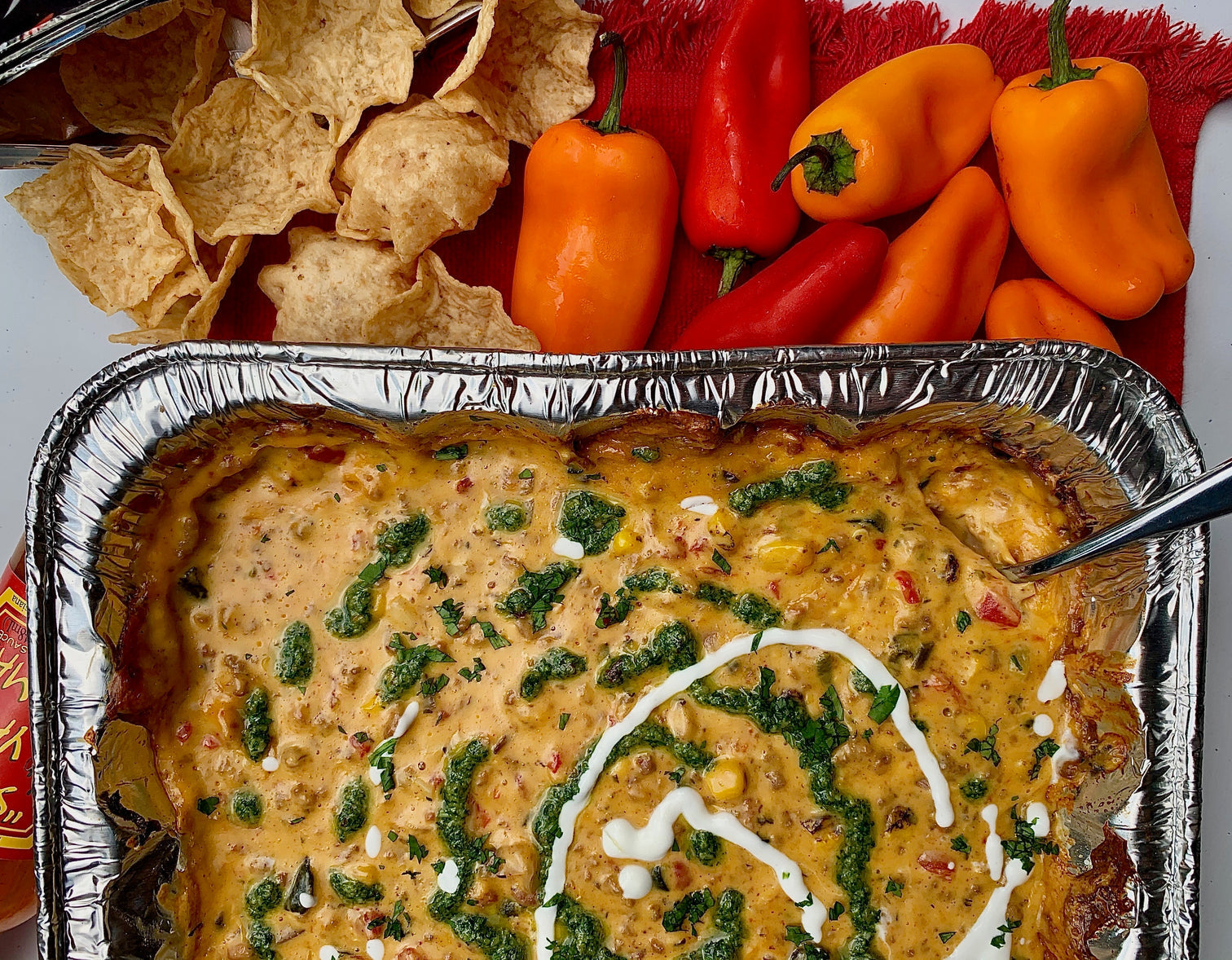 Smoked Taco Queso With Cilantro Pesto & Lime Crema