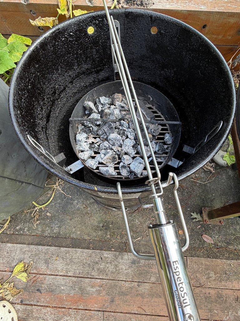 BBQ BOI Pit Barrel Grate Mates supporting a rotisserie attachment inside a Pit Barrel Cooker over the charcoal basket